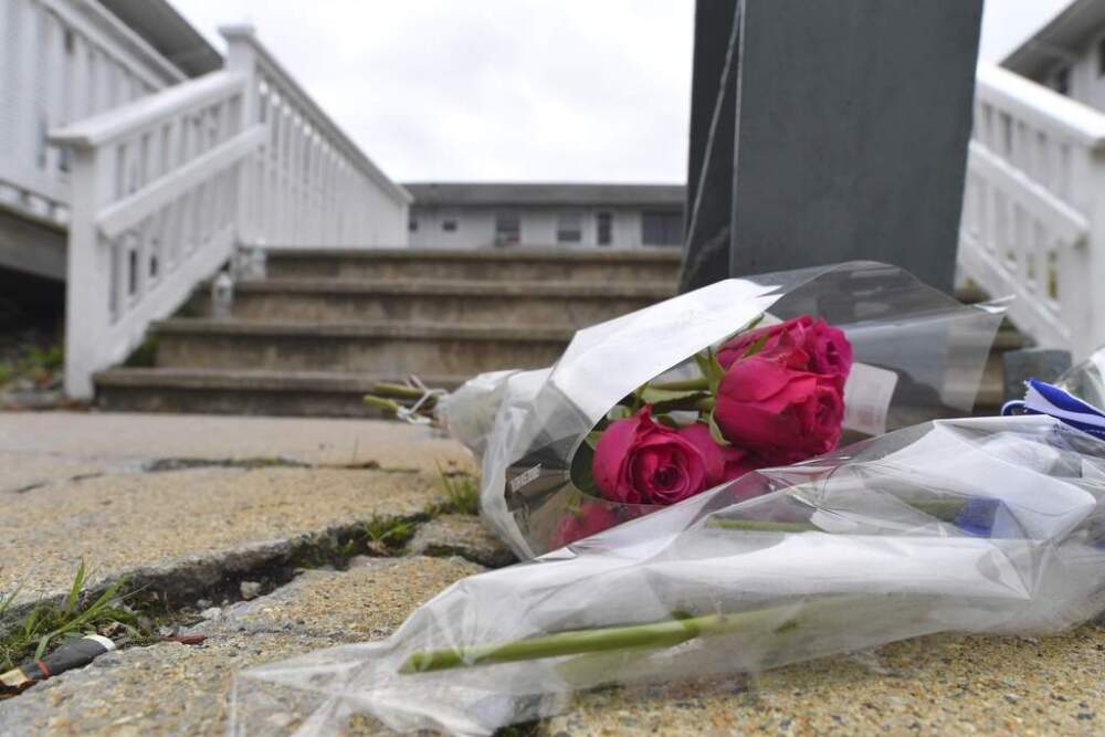 Flowers rest near an entrance to the Gabriel House assisted living facility on Monday. (Steven Senne/AP)