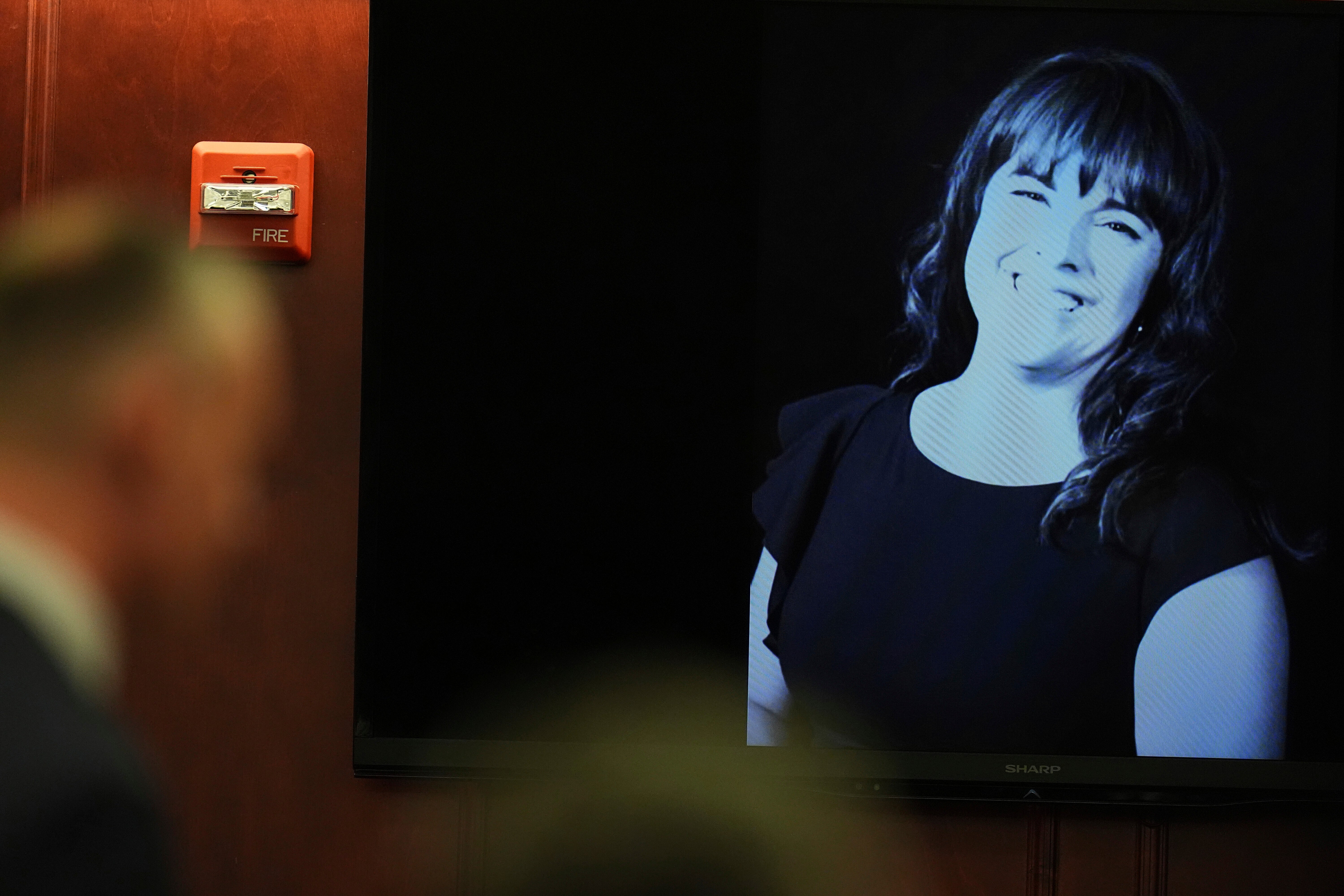 Prosecutor Michael Mauro, front left, makes a point during closing arguments as an image of Angela Craig is cast on a screen