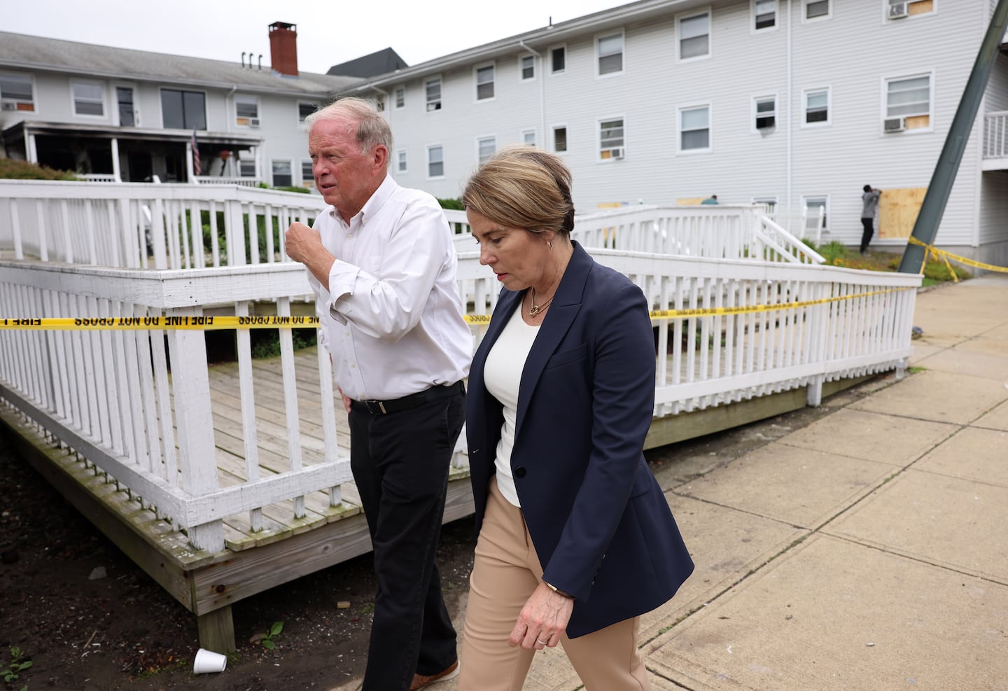 Fall River Mayor Paul Coogan (L) and Massachusetts Governor Maura Healey walk past the Gabriel House Assisted Living Facility after a fire there killed 9 people  in Fall River, MA on July 14, 2025.