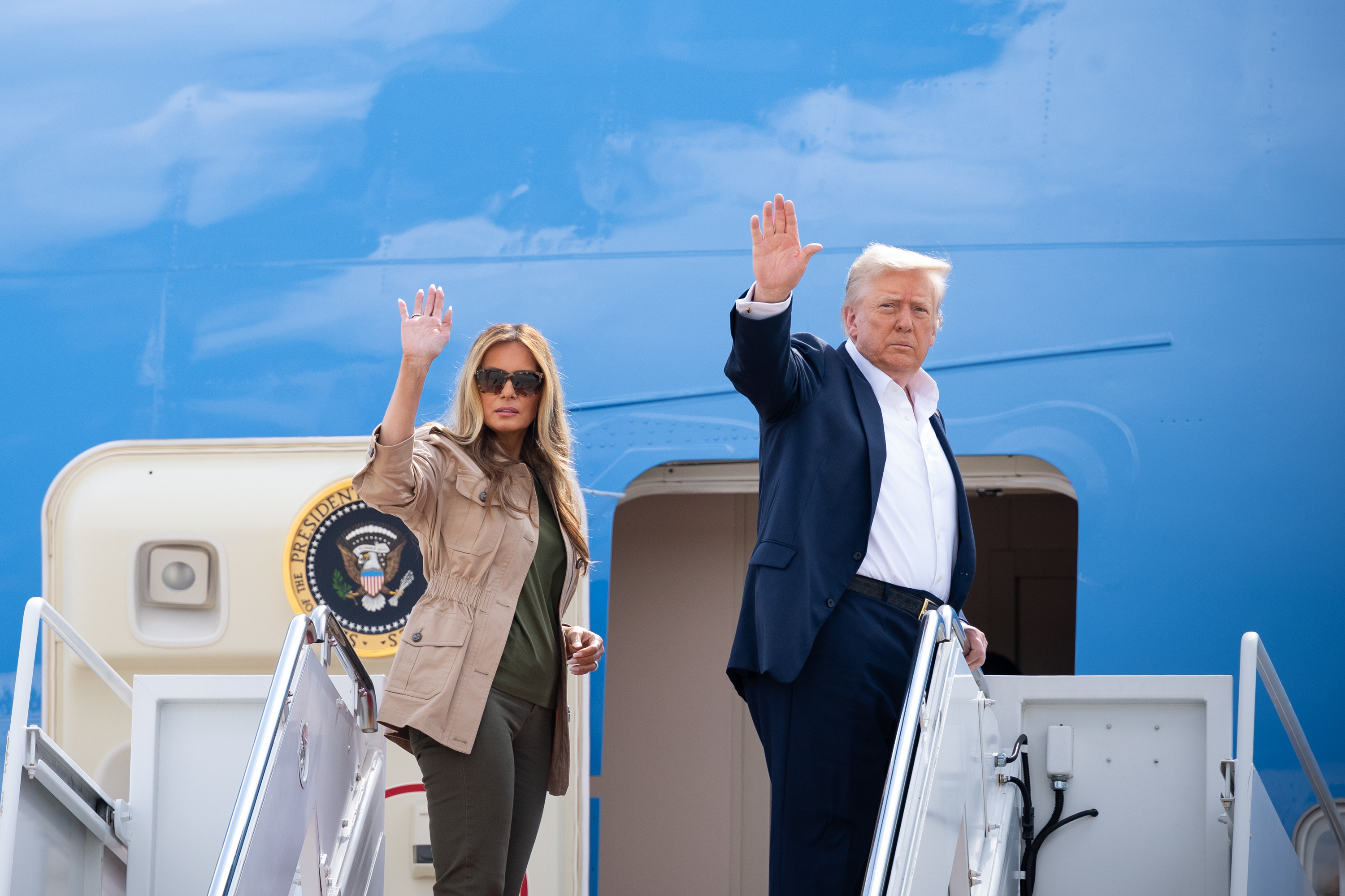 President Donald Trump and First Lady Melania Trump disembark Marine One at Joint Base Andrews on Friday, July 11, 2025, and board Air Force One for a trip to visit areas impacted by flooding in Kerr County, Texas. (Official White House Photo by Andrea Hanks)