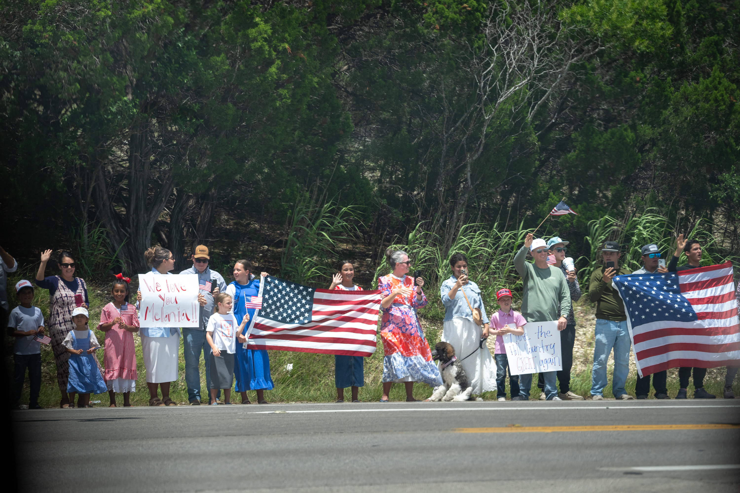 Supporters stand along the route welcoming President Donald Trump and First Lady Melania Trump who are visiting the areas impacted by recent deadly flooding, Friday, July 11, 2025, in Kerrville, Texas. (Official White House Photo by Andrea Hanks)