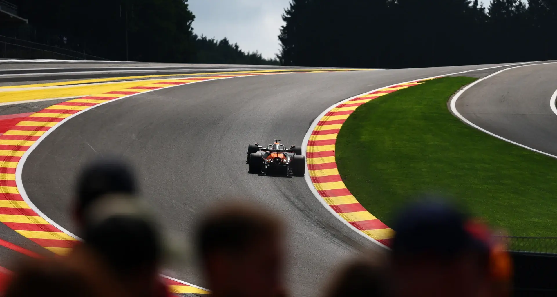 SPA, BELGIUM - JULY 24: Lewis Hamilton of Great Britain and Scuderia Ferrari talks with Andrea Kimi
