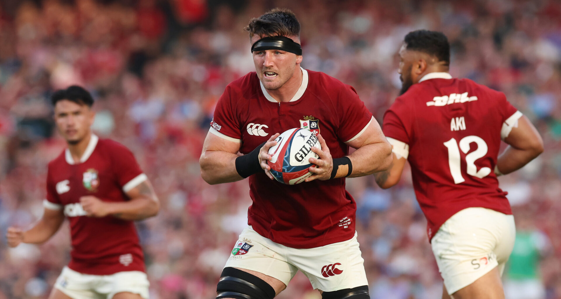 The British & Irish Lions' Tom Curry runs with the ball during the June 2025 match against Argentina.