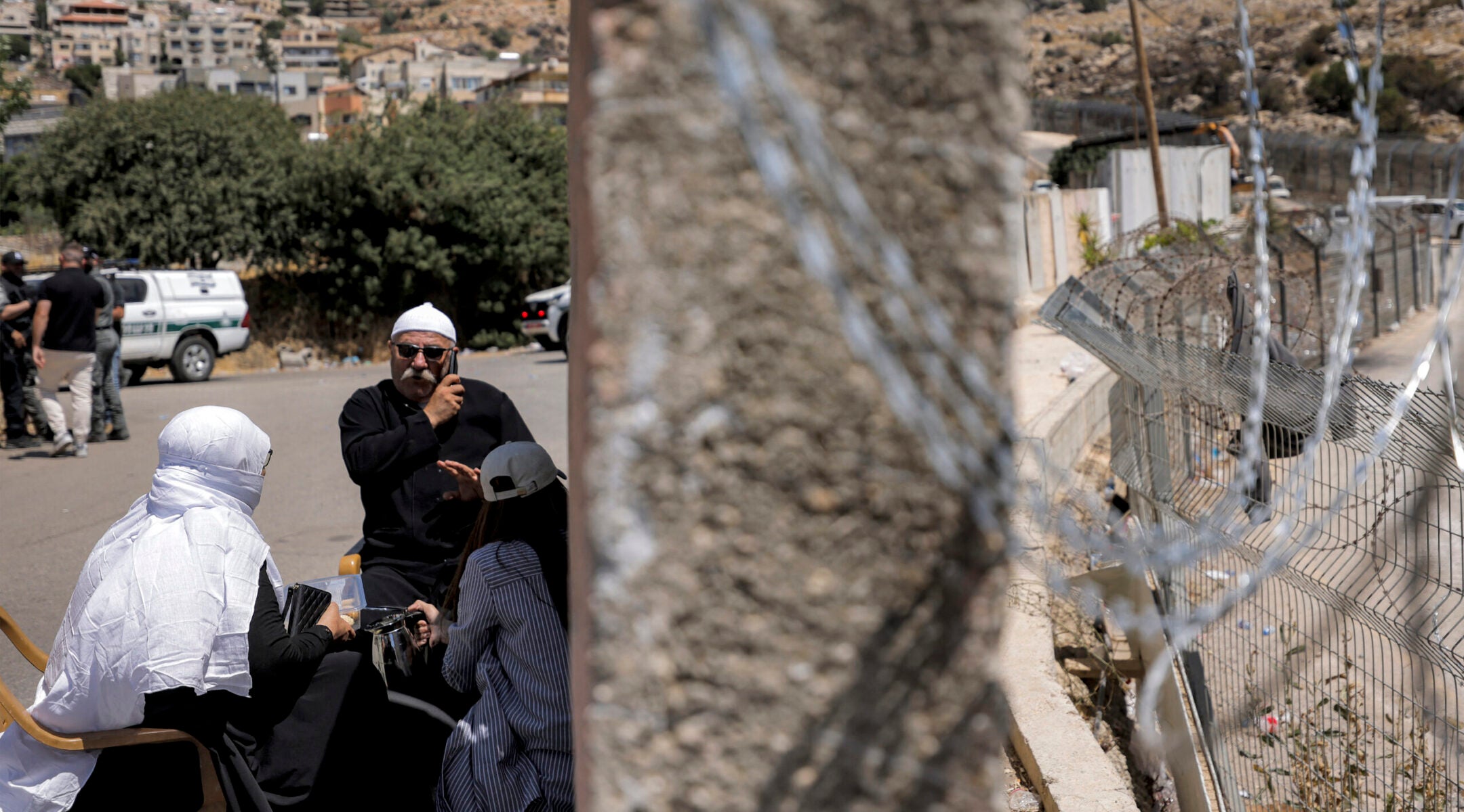 Members of the Druze community gather along the dividing line with the buffer zone as they wait for a chance to see relatives on the Syrian side near the Druze village of Majdal Shams, in the Golan Heights region of Israel, on July 19, 2025. (Jalaa Marey / AFP via Getty Images)