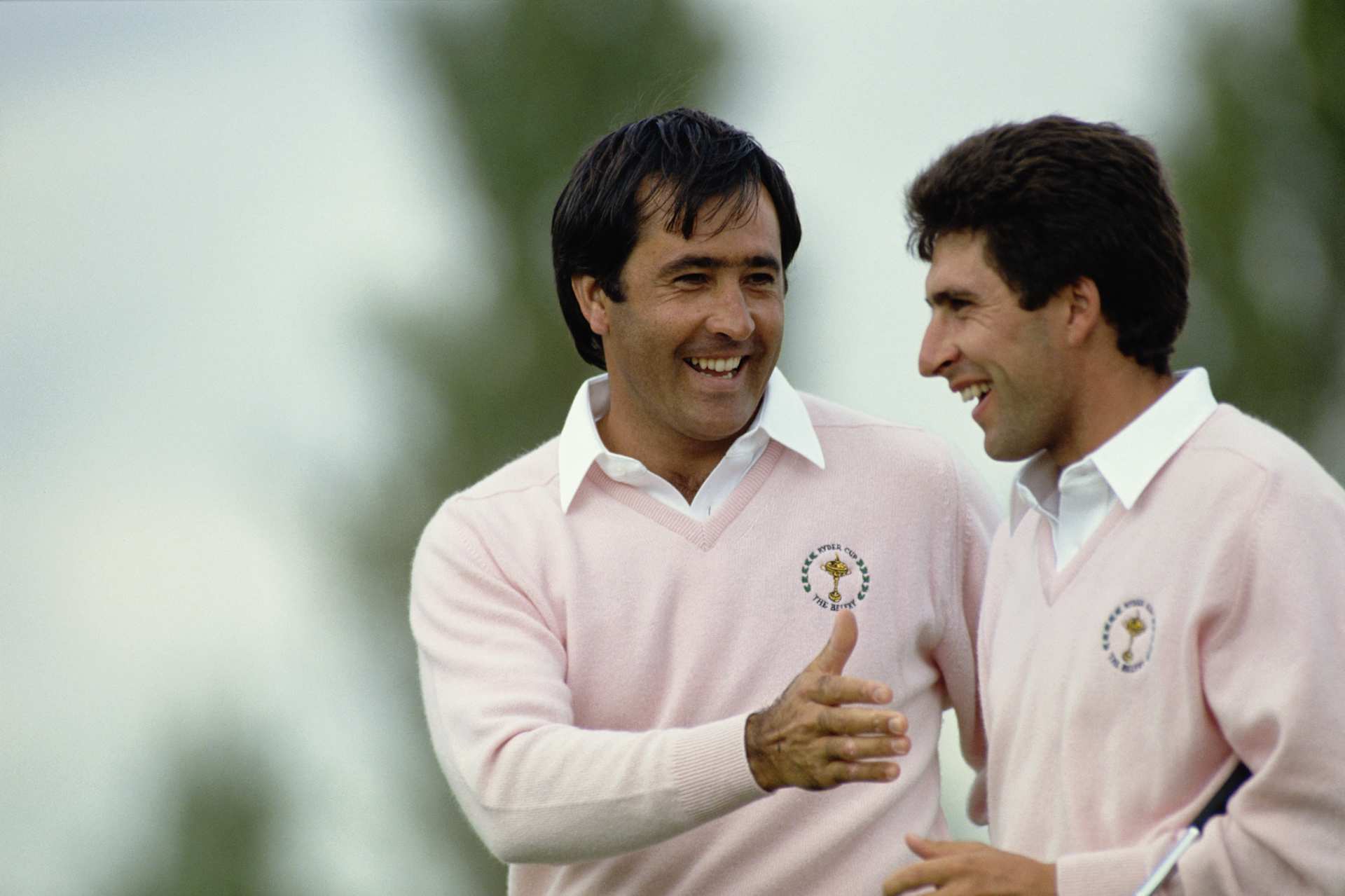 Spanish golfers Severiano Ballesteros (left) and Jose Maria Olazabal shaking hands during a Ryder Cup match at The Belfry, Warwickshire, 22nd September 1989. The competition ended in a draw with the European team retaining the Cup. (Photo by David Cannon/Getty Images)
