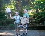 Protesters wait to cross the street following a “Good Trouble” protest nearby Laurelhurst Park in Portland, Ore., July 17, 2025. These “Good Trouble” demonstrations in various areas around Portland were part of a nationwide effort to protest against the Trump Administration in the name of the late congressman John Lewis of Georgia. 