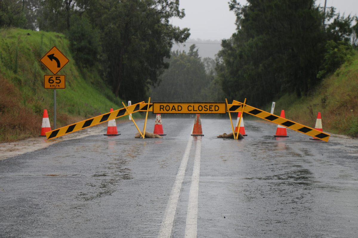 road closed sign at flooded road