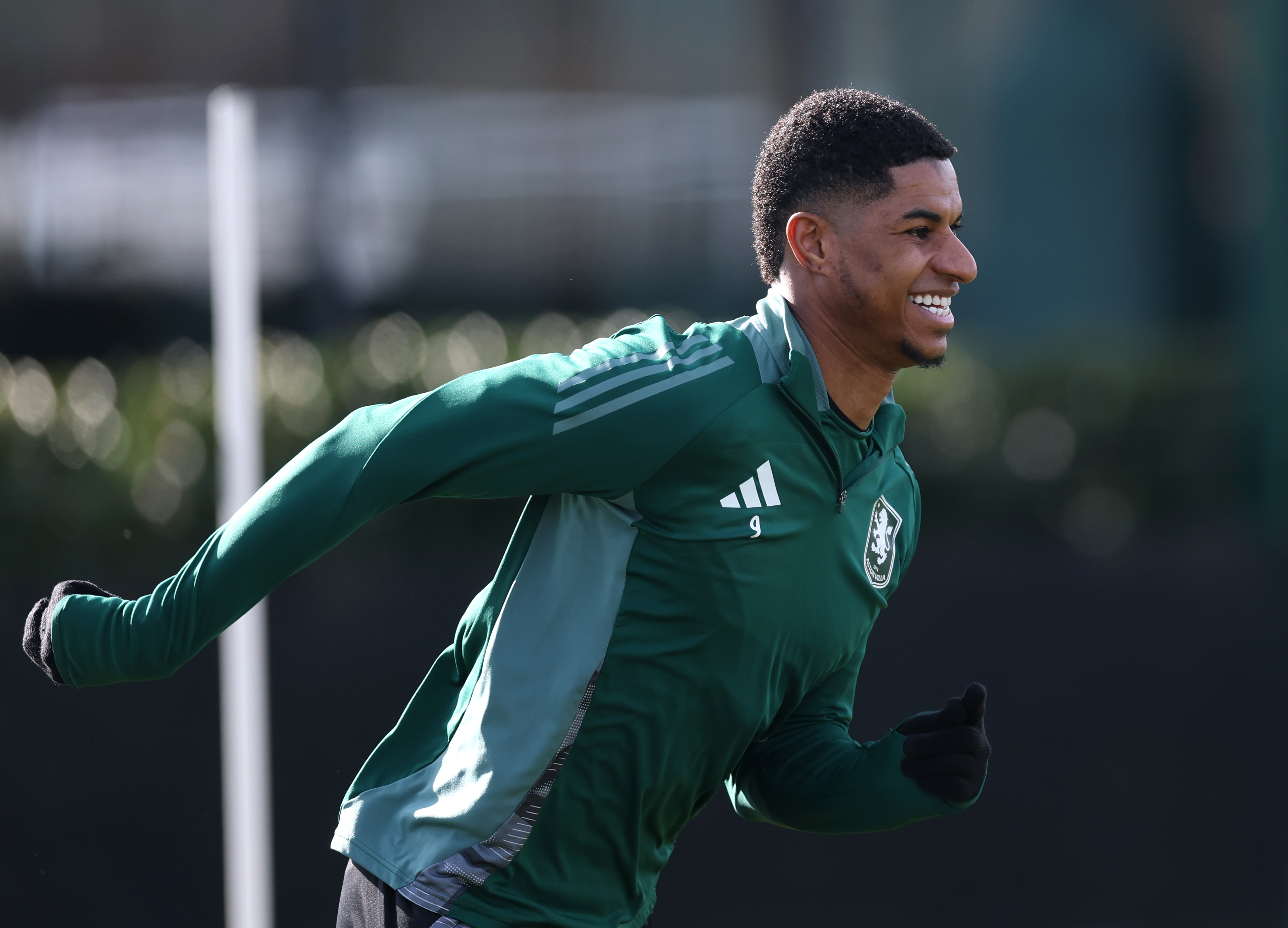 Marcus Rashford all smiles in Aston Villa training