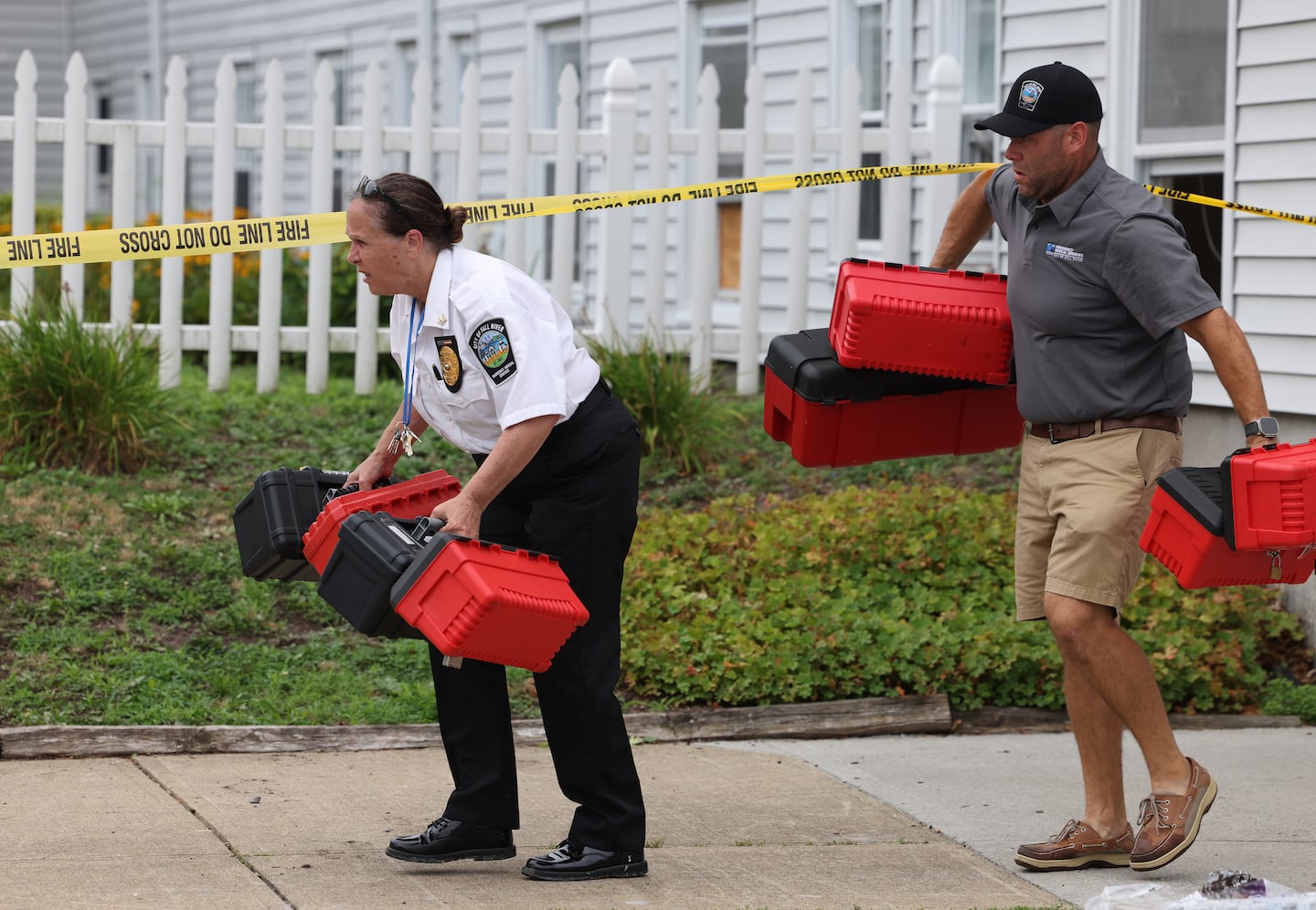 Officials remove boxes of medication that belonged to the residents of the Gabriel House Assisted Living Facility where a fire killed 9 people  in Fall River, MA on July 14, 2025. 