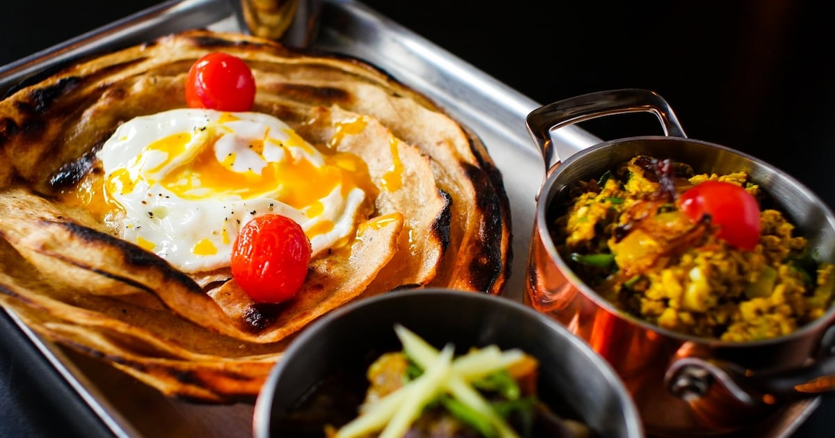 Garda raid on home of award-winning curry restaurant owner finds bank card in worker’s name – The Irish Times