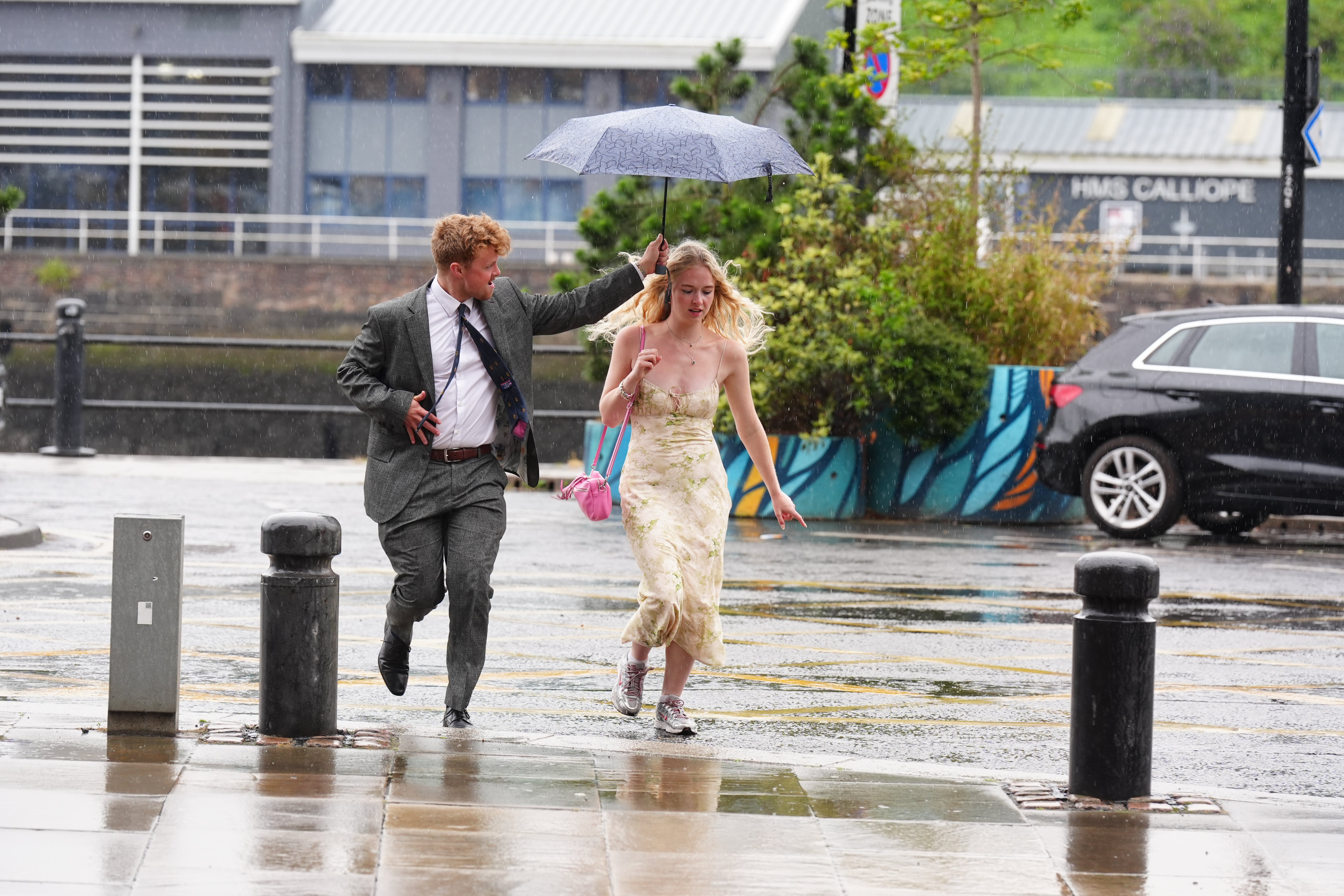People walking in the rain at Newcastle Quayside.