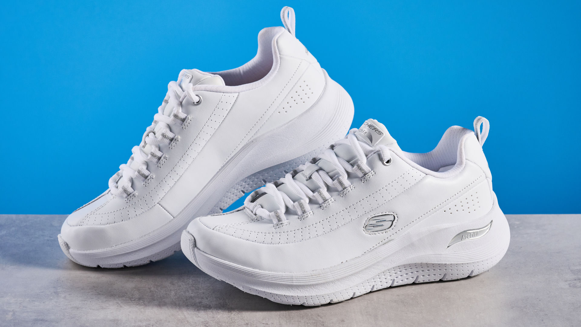 Skechers Arch Fit 2.0 Star Bound photographed in front of a blue background.