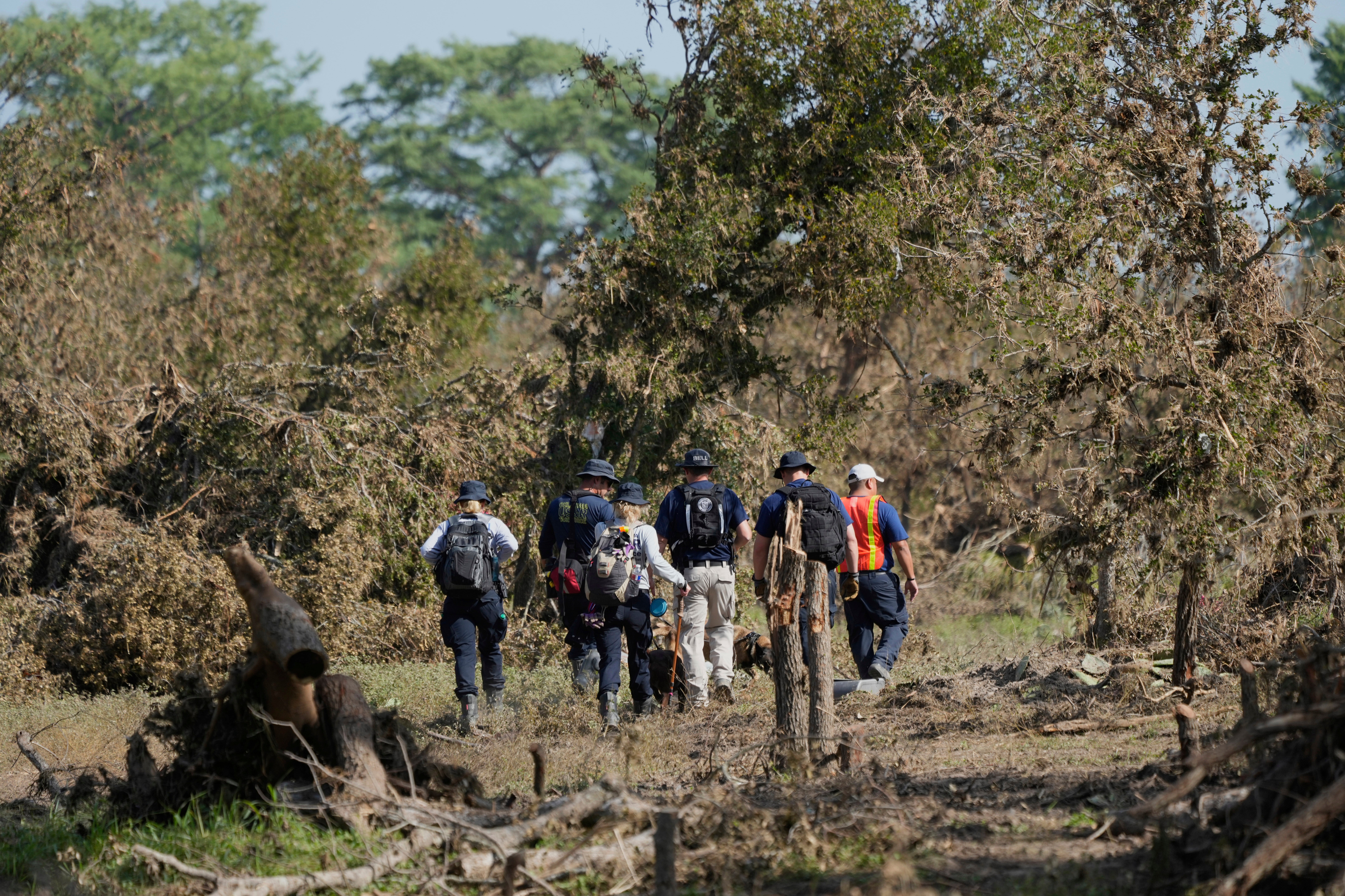 Search crews from Oklahoma Task Force One search for missing people near the Guadalupe River