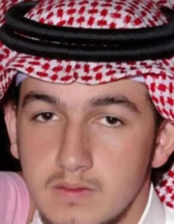 Close-up of a young man wearing traditional Saudi headwear, representing the Sleeping Prince of Saudi Arabia.