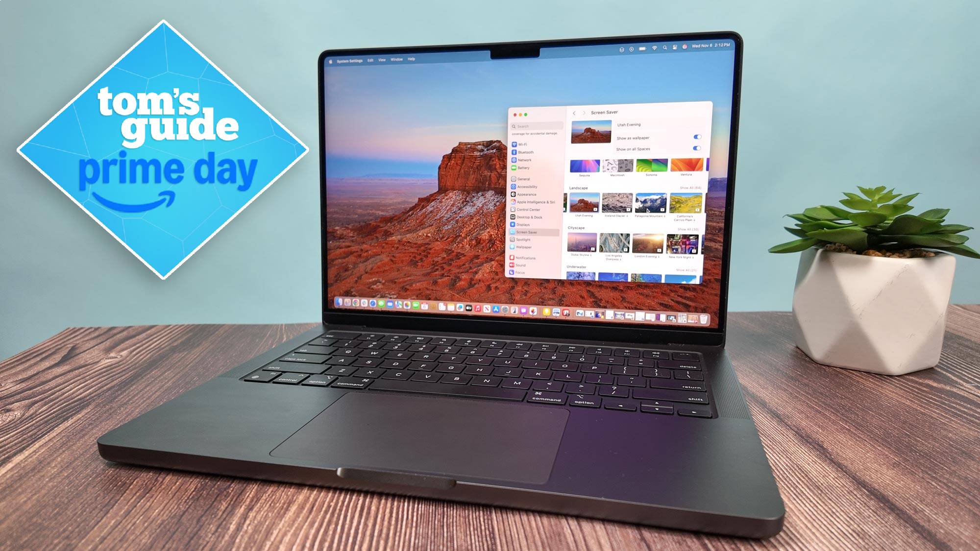 MacBook Pro 14 M4 on table with Tom's Guide Prime Day badge