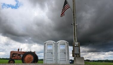 Storm clouds bring rain to a produce stand in Elmer, N.J., on Sunday; expect a rinse, repeat Monday.