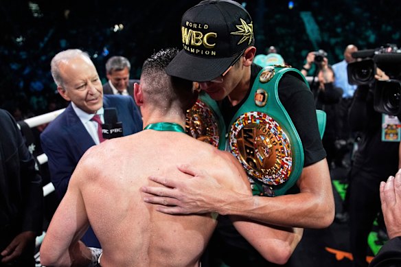 The fighters embrace once it is all over.