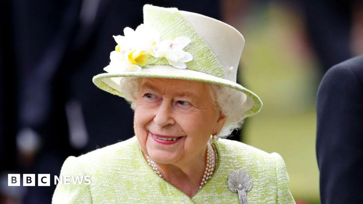 Queen Elizabeth II in a green dress and hat in a photo from 2019