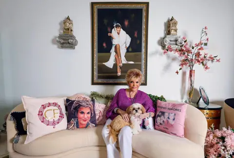 Getty Images Connie Francis poses in her house with a dog on her lap