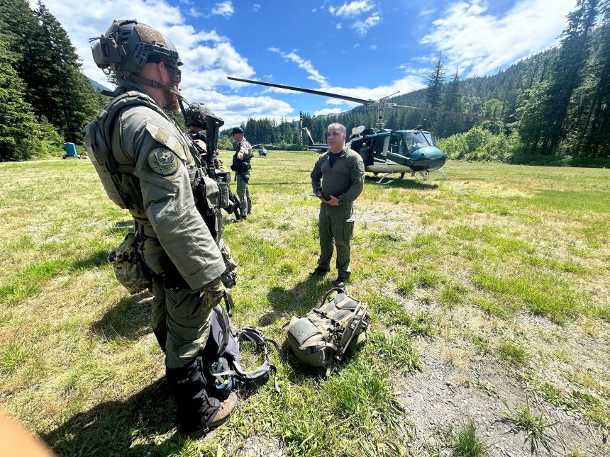 Deputies participate in the search for Travis Decker in Washington state, June 6.