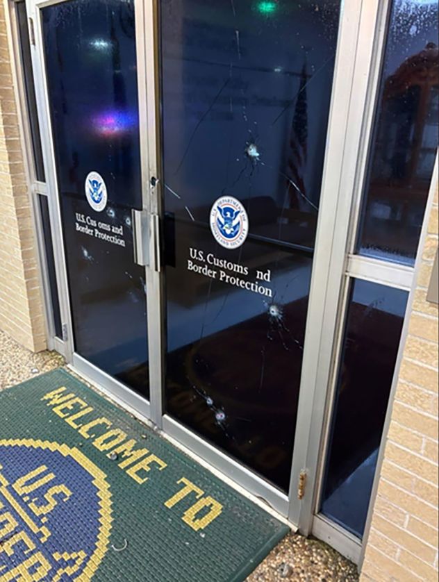 Bullet holes are seen in the door of a US Customs and Border Protection facility in McAllen, Texas, on July 7.