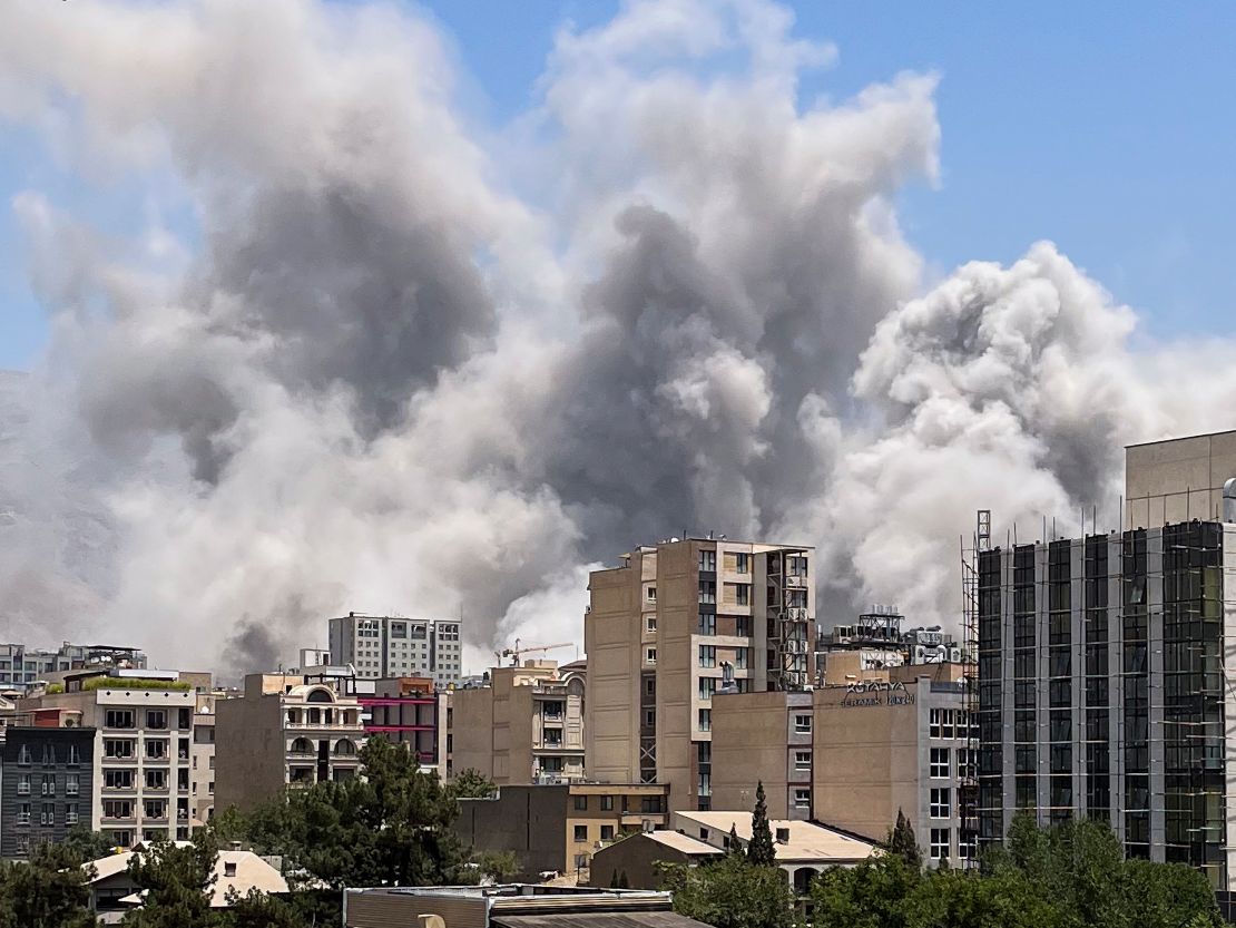 Smoke rises in north Tehran on June 23, 2025.