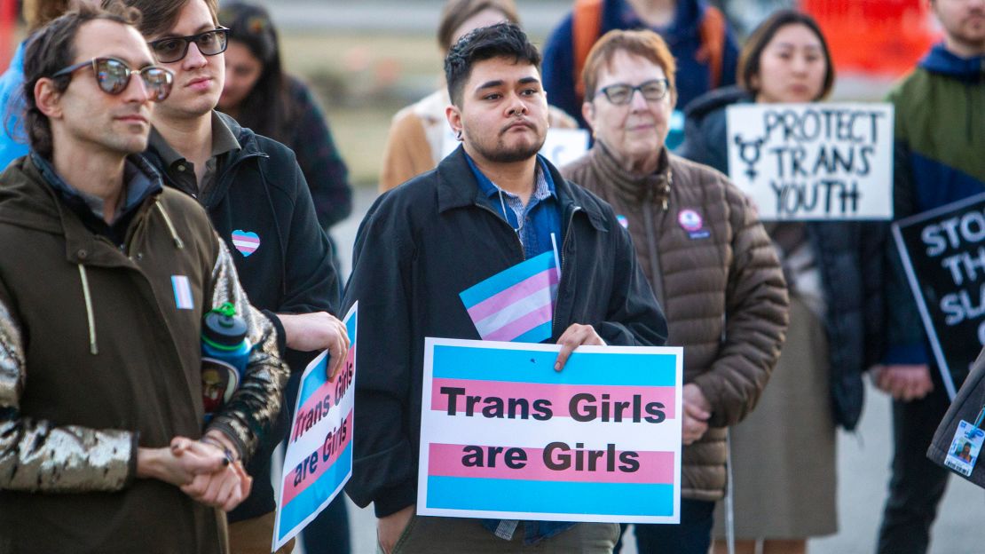 In this 2020 photo, more than 100 people rallied at the Capitol in Boise, Idaho, in support of transgender students and athletes