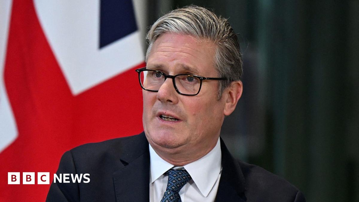 Prime Minister Keir Starmer during a joint press conference, with a union jack flag in the background