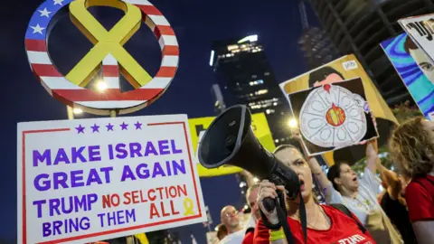 AFP Families of Israeli hostages held by Hamas in Gaza protest outside the Israeli military's headquarters in Tel Aviv, Israel (5 July 2025)