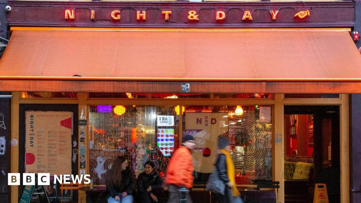 People walking past the Night and Day music venue in Manchester