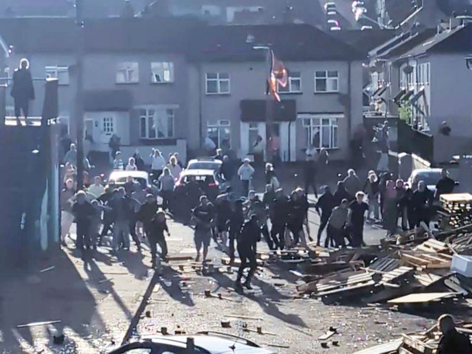 Videos circulating online show people, some of them with their faces covered, fighting in the street.