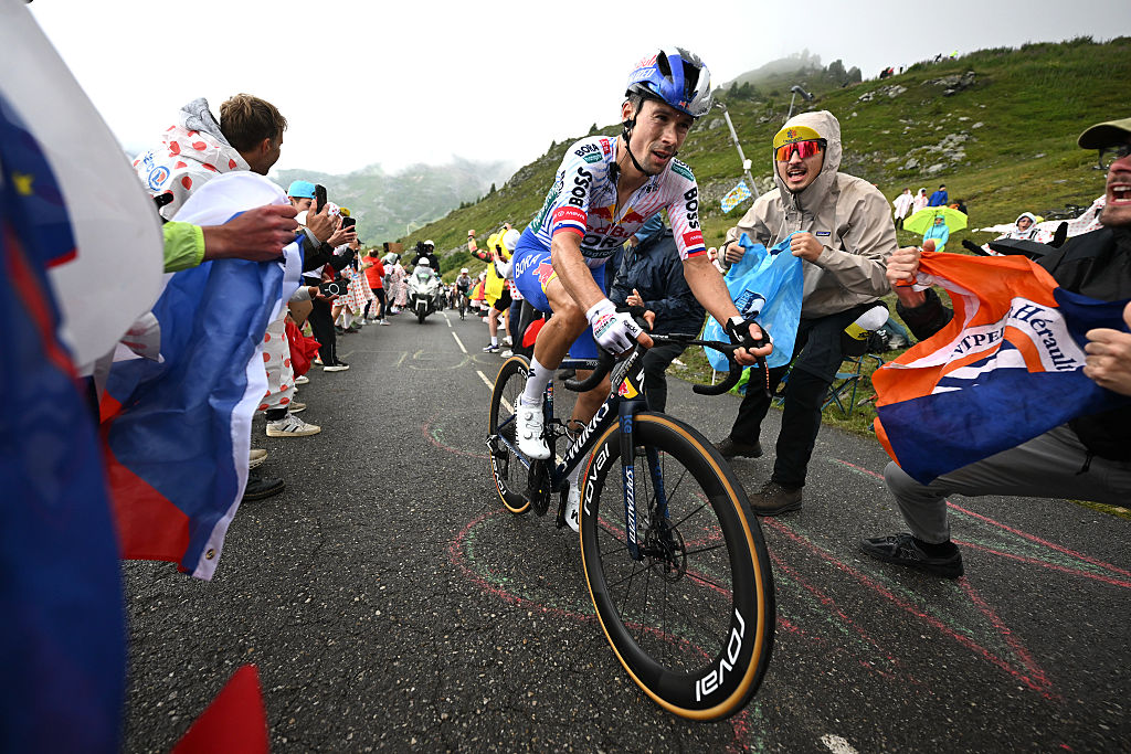 COURCHEVEL - COL DE LA LOZE, FRANCE - JULY 24: Primoz Roglic of Slovenia and Team Red Bull - BORA - hansgrohe competes climbing the Col de la Loze while fans cheer during the 112th Tour de France 2025, Stage 18 a 171.5km stage from Vif to Courchevel - Col de la Loze 2298m / #UCIWT / on July 24, 2025 in Courchevel - Col de la Loze, France. (Photo by Tim de Waele/Getty Images)