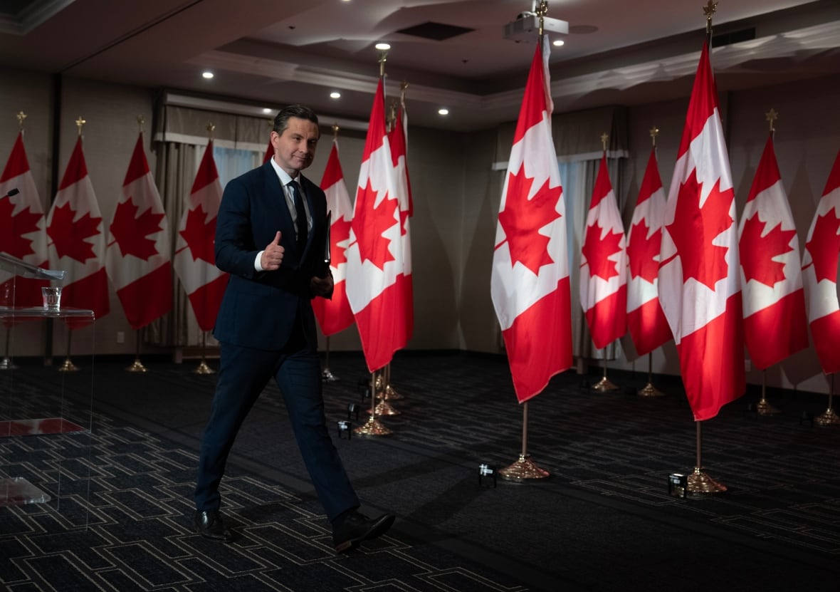Conservative Leader Pierre Poilievre gives a thumbs up as he leaves a news conference in Ottawa on Monday, July 14, 2025.