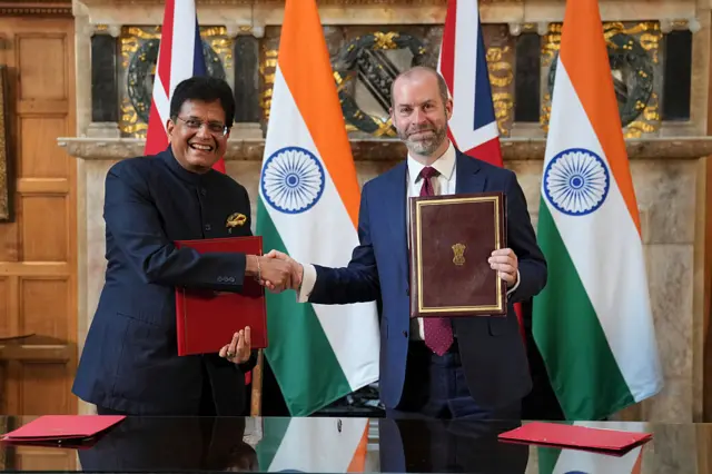 Britain's Secretary of State for Business and Trade, Jonathan Reynolds, right, and Piyush Goyal, Minister of Industry and Supply of India, shake hands after they signed a free trade agreement at Chequers on July 24, 2025