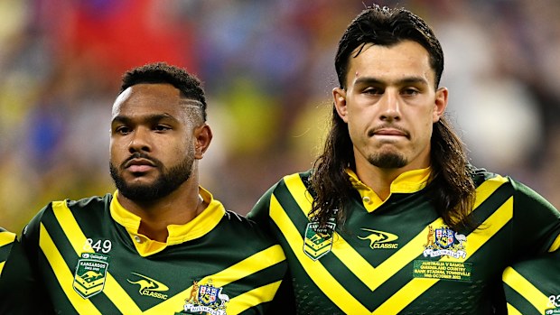Hamiso Tabuai-Fidow, Tino Fa'asuamaleaui and harry Grant line up for the national anthems during the Pacific Championship match between Australia Kangaroos and Samoa at Queensland Country Bank Stadium on October 14, 2023 in Townsville, Australia. (Photo by Ian Hitchcock/Getty Images)