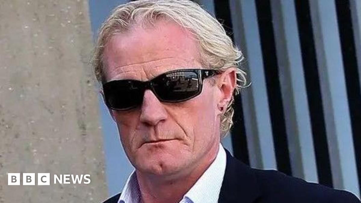 Colin Hendry has blonde hair and is wearing sunnies, a white shirt and dark jacket.