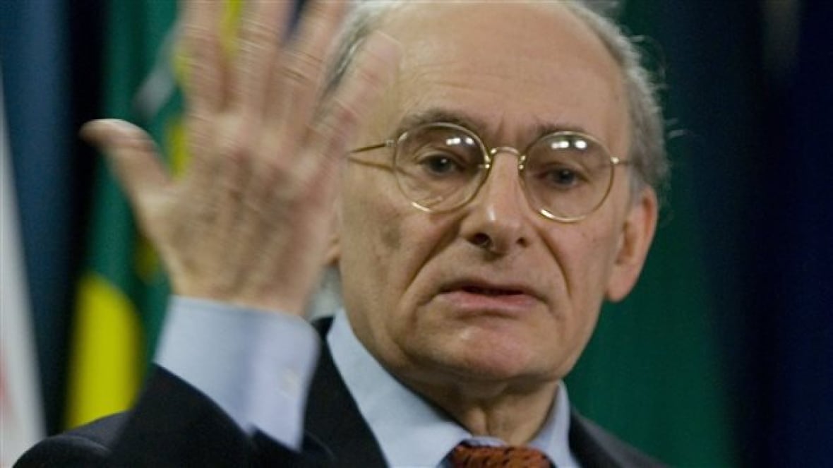 A man waving his hand. 