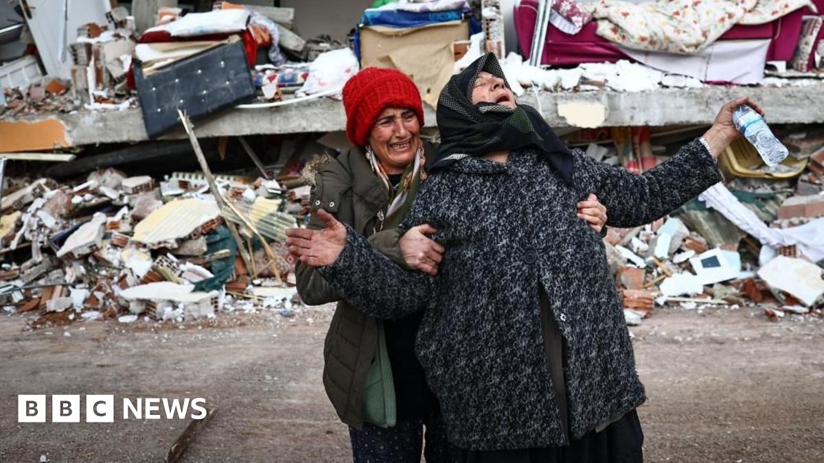 Women react at the site of a collapsed building in the aftermath of a major earthquake in the Elbistan district of Kahramanmaras in Turkey
