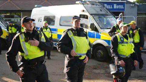 PA Media image shows police officers in Epping