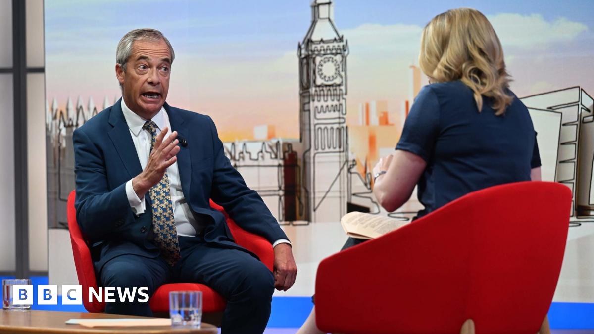 Nigel Farage being interviewed in a TV studio by the BBC's Laura Kuenssberg, who has her back to the camera.
