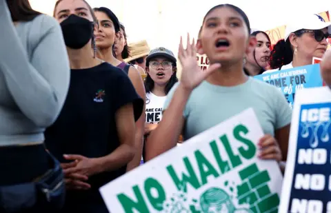 Los Angeles Times via Getty Image People protest against immigration raids earlier this month.