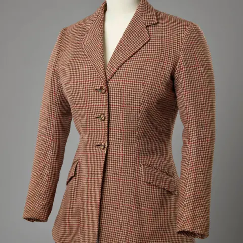 ROYAL COLLECTION TRUST A hacking jacket worn by the late Queen Elizabeth II