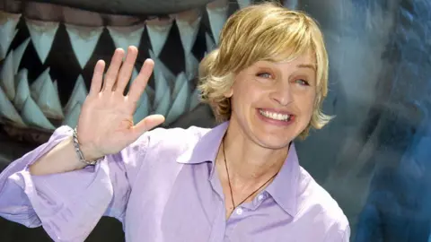 Getty Images Ellen smiling and waving at the Finding Nemo premiere in 2003