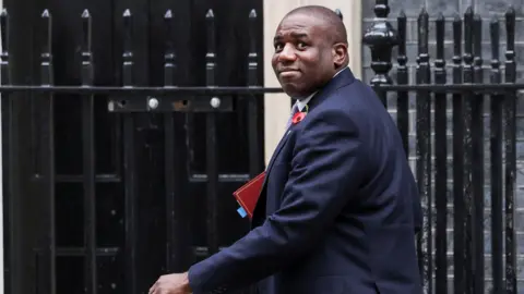 Reuters Foreign Secretary David Lammy has insisted that UK flights over Gaza have not shared intelligence with Israel. Lammy is seen walking into Number 10 Downing Street and is holding a binder. 