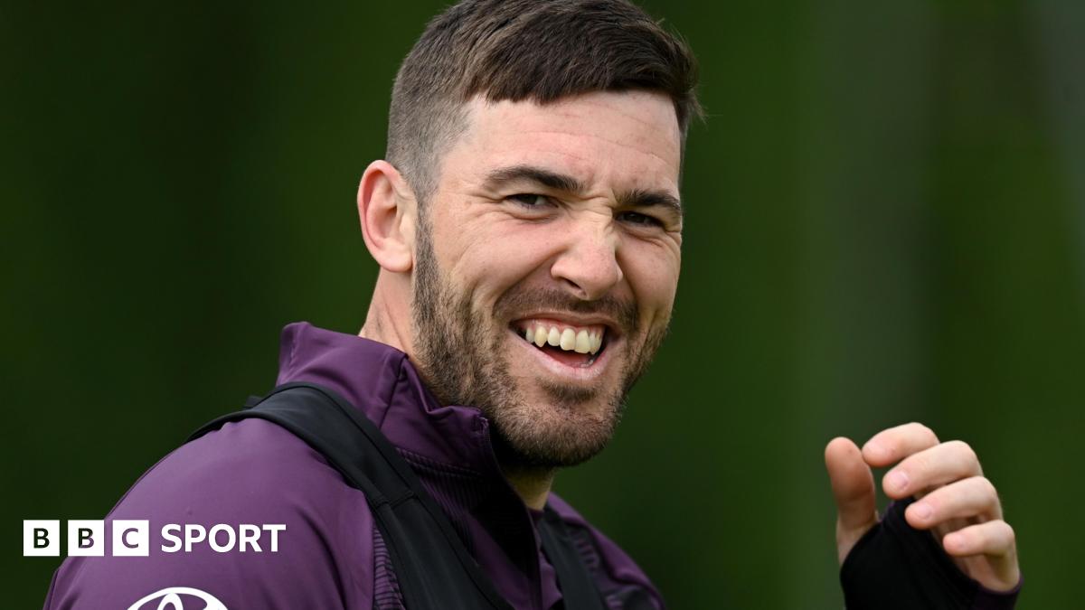 Jamie Overton looks toward the camera