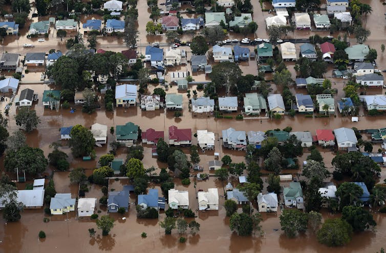 floodwaters surrounding homes