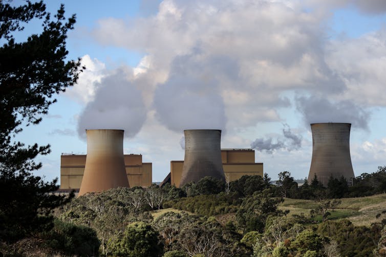 steam billows from coal-fired power station.