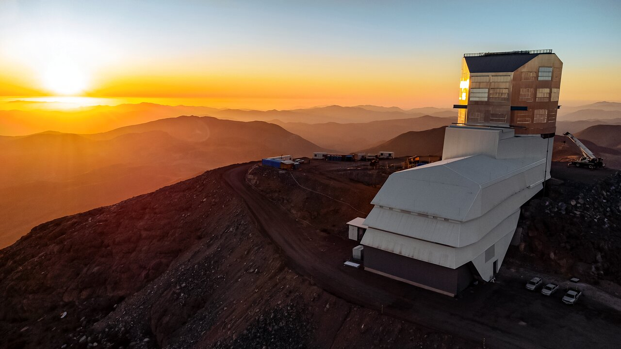 The Vera C. Rubin Observatory, seen against the sunset in Oct. 2023 as its construction nears completion