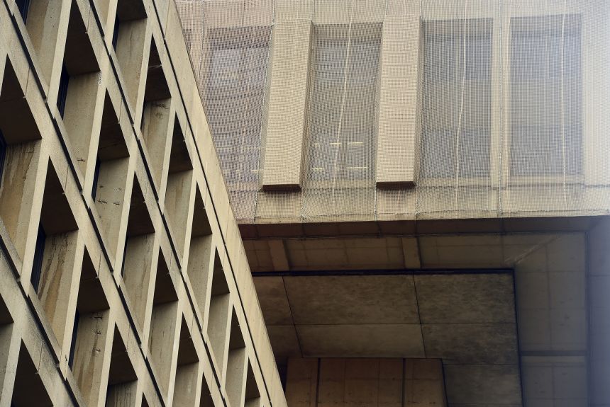 A net was placed over the top level of the J. Edgar Hoover Building to collect falling pieces of concrete. The crumbling facade is one reason the FBI has been trying to find a new headquarters.