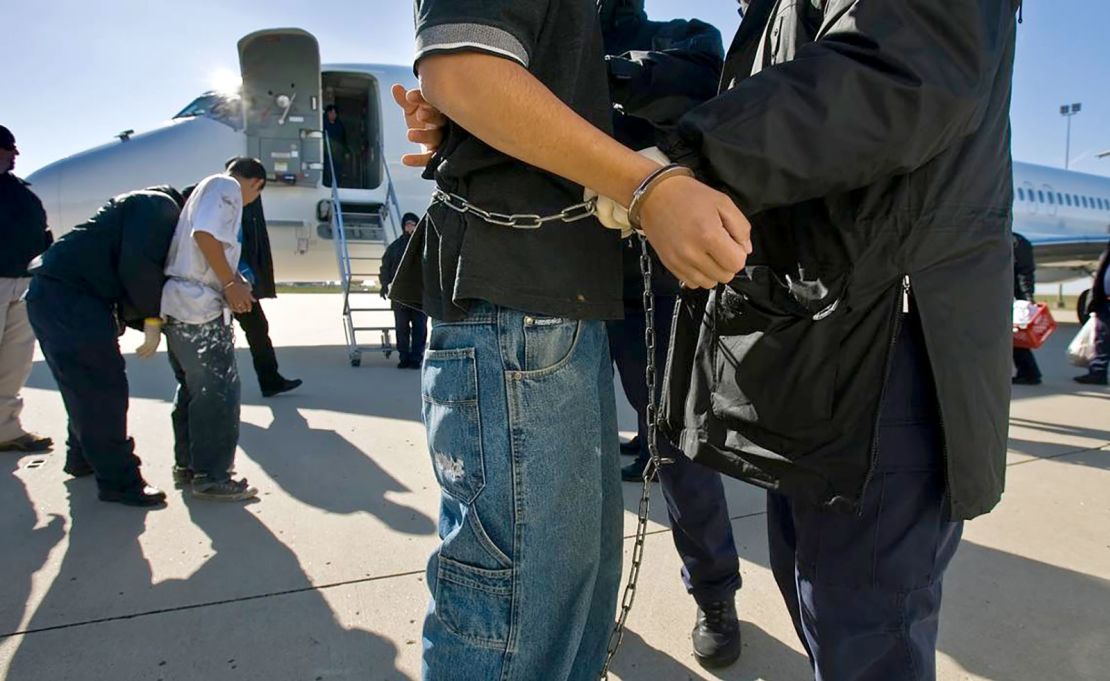 Undocumented immigrants, shackled at the wrists and ankles, were searched before boarding a charter flight at Kansas City International Airport, run by the Immigration and Customs Enforcement (ICE) Department. The detainees were flown to Louisiana, Texas or Arizona, where they are returned to or flown to the detainees countries of origin, on December 2, 2024.